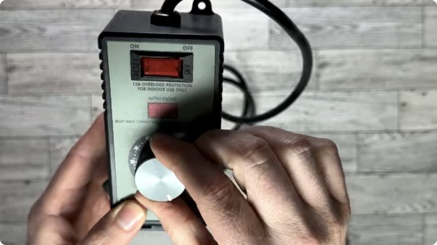 Plug-in AC motor speed controller with rotary dial and voltage display