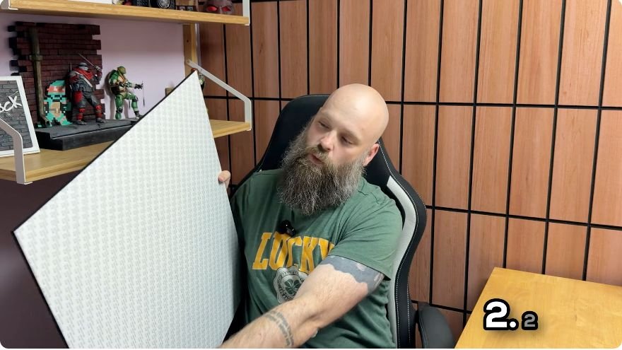 Showing the full peel-and-stick backing on a 23.62-inch acoustic wall panel